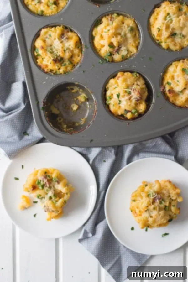 overhead: mac and cheese cup baked in a muffin tin with two removed and on two circular white plates