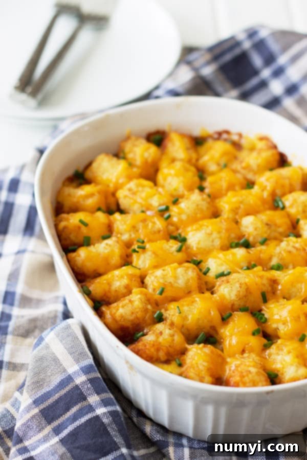 Hearty Chili Cheese Tater Tot Casserole baked to perfection in a rectangular dish, golden brown tater tots on top.