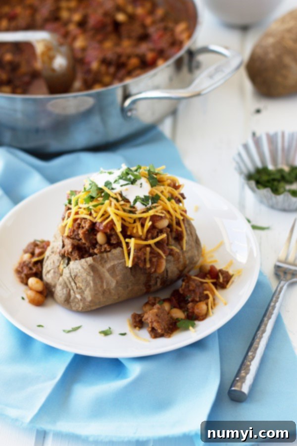 Close-up shot of a delicious taco baked potato, showing the rich texture of the seasoned beef.