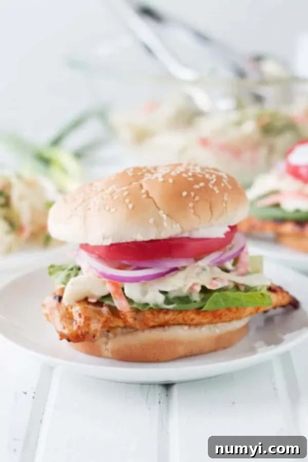 grilled buffalo chicken sandwich on white plate