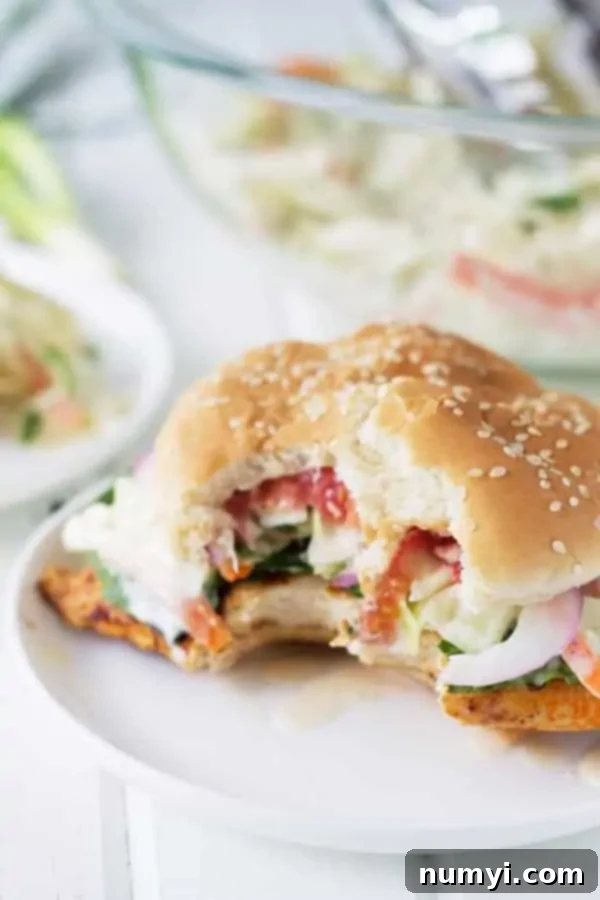 grilled spicy chicken sandwich with bite out of it