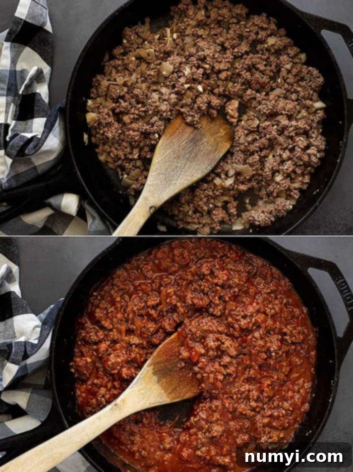 Process shot showing ground beef, onions, and garlic browning in a large skillet, the first step in making homemade sloppy joes.