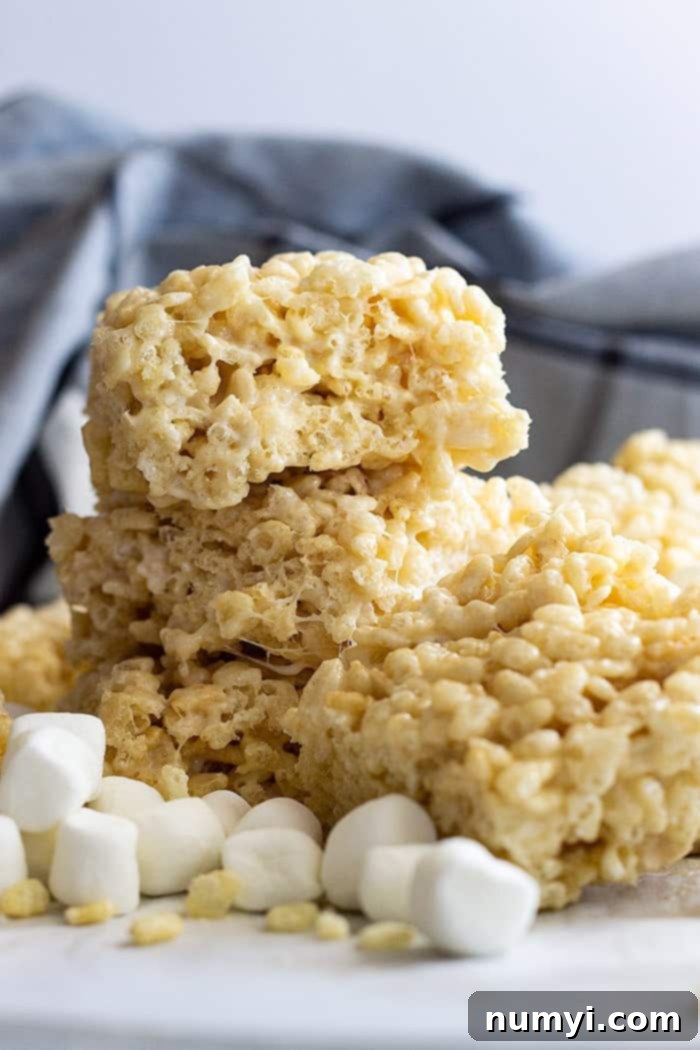 stack of big rice crispy treats, golden brown and perfectly square