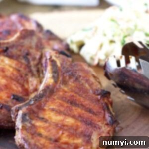 Effortless Smoked BBQ Pork Chops 6 Close up of a Quick Smoked BBQ Pork Chop with a sweet glaze.