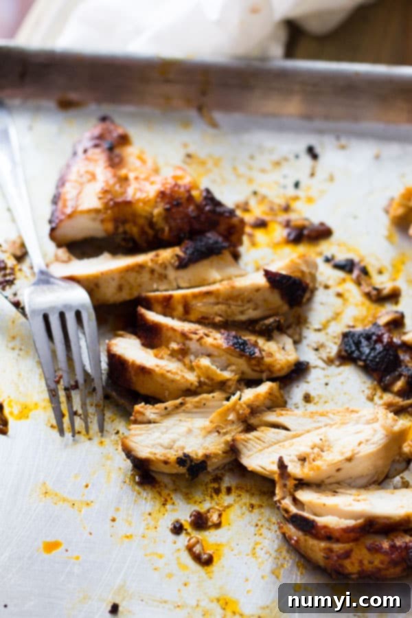 The finished Applewood Grill Smoked Chicken, golden brown and glistening, ready to be sliced and served.