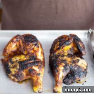 Crispy, golden-brown Applewood Grill Smoked Chicken halves.