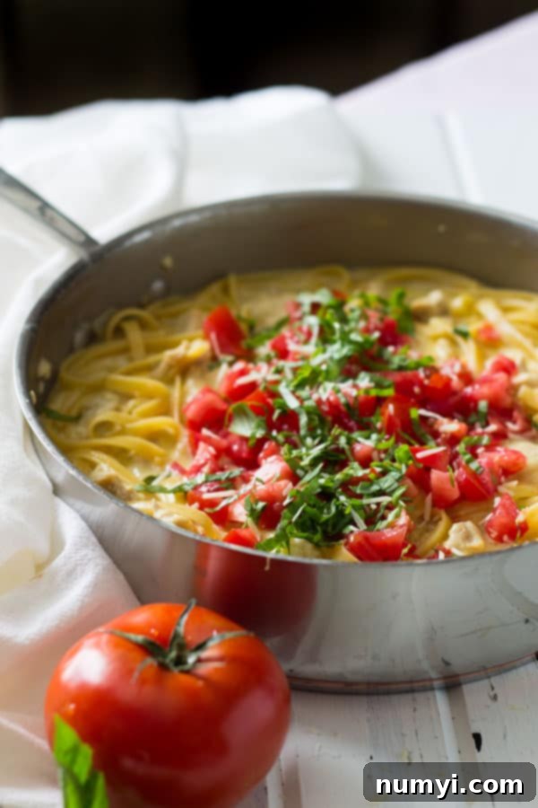Creamy One Pot Chicken Tomato Basil Alfredo in a large skillet