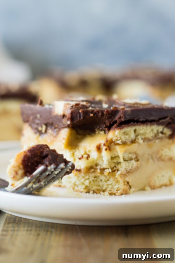 This Twix Icebox Cake is an easy and decadent no-bake cake. Made with homemade pudding, shortbread cookies, caramel and chocolate! | www.countrysidecravings.com