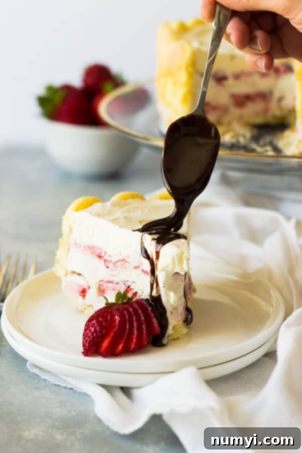 Ladyfinger Strawberry Ice Cream Cake -an easy and eye catching dessert. Layered with strawberry ice cream, luscious strawberries and topped with freshly whipped cream! | www.countrysidecravings.com 