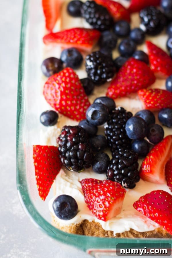 Triple Berry French Toast Casserole -an easy yet impressive breakfast casserole. Layered with thick texas toast, cream cheese, fresh berries and an egg custard! | www.countrysidecravings.com