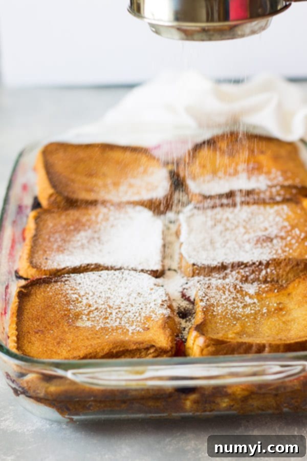 Delicious layers of Texas toast, cream cheese, and fresh berries in an impressive French toast casserole.