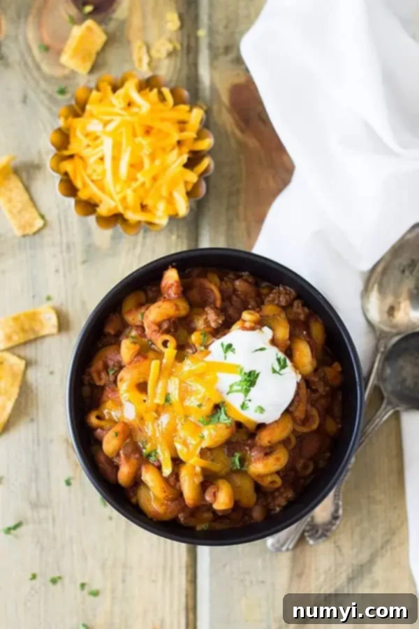 Top-down view of a single bowl of Crockpot chili mac.