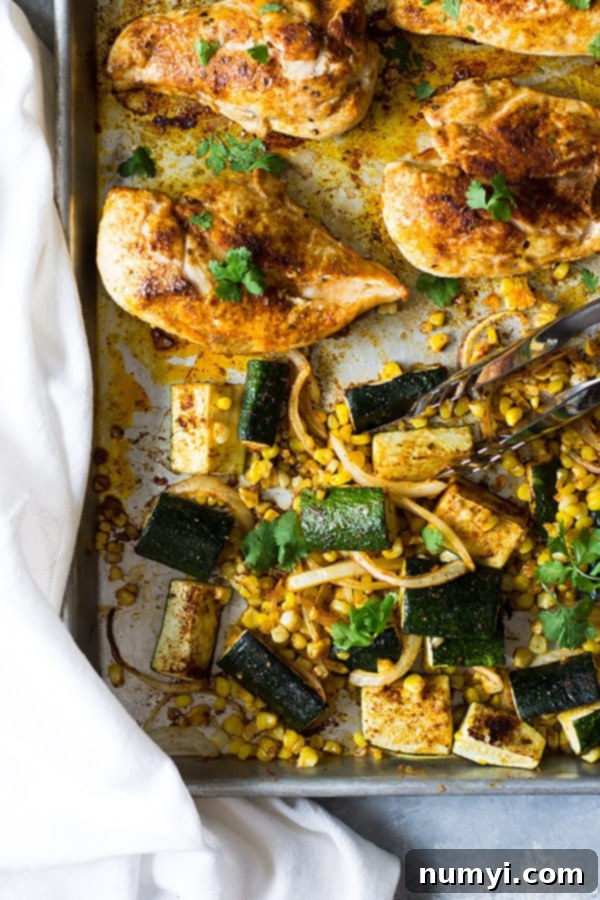 Easy Sheet Pan Mexican Chicken and Vegetables made with fresh corn, zucchini, onion, seasoned to perfection and done in 30 minutes! | www.countrysidecravings.com