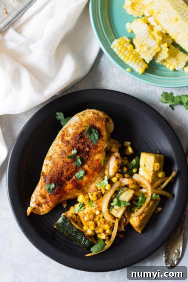 Easy Sheet Pan Mexican Chicken and Vegetables made with fresh corn, zucchini, onion, seasoned to perfection and done in 30 minutes! | www.countrysidecravings.com