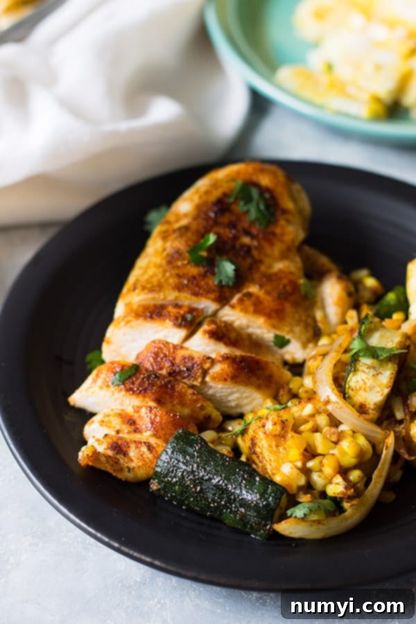 Easy Sheet Pan Mexican Chicken and Vegetables made with fresh corn, zucchini, onion, seasoned to perfection and done in 30 minutes! | www.countrysidecravings.com