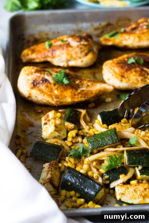 Easy Sheet Pan Mexican Chicken and Vegetables made with fresh corn, zucchini, onion, seasoned to perfection and done in 30 minutes! | www.countrysidecravings.com