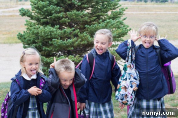 A picture of children excited for their first day of school, capturing a candid, joyful moment.
