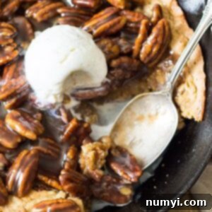 A delicious Skillet Blondie with Bourbon Caramel Pecans