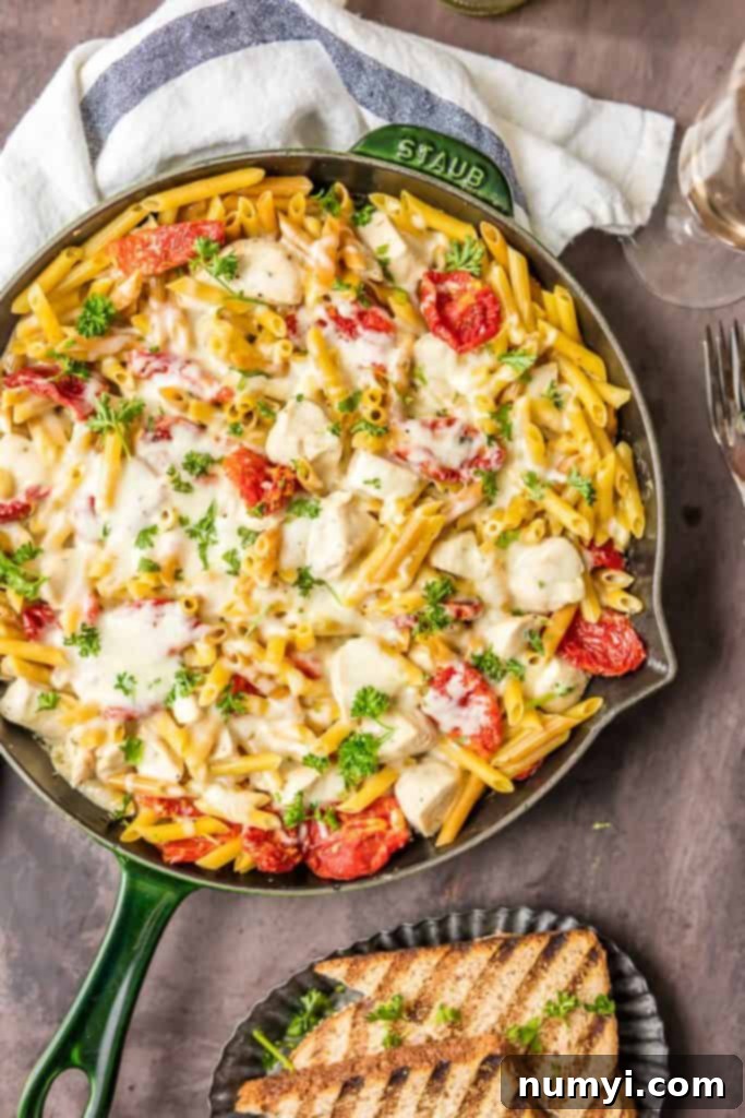 One Pot Chicken Alfredo Skillet: a classic, creamy chicken alfredo pasta dish cooked entirely in one skillet.