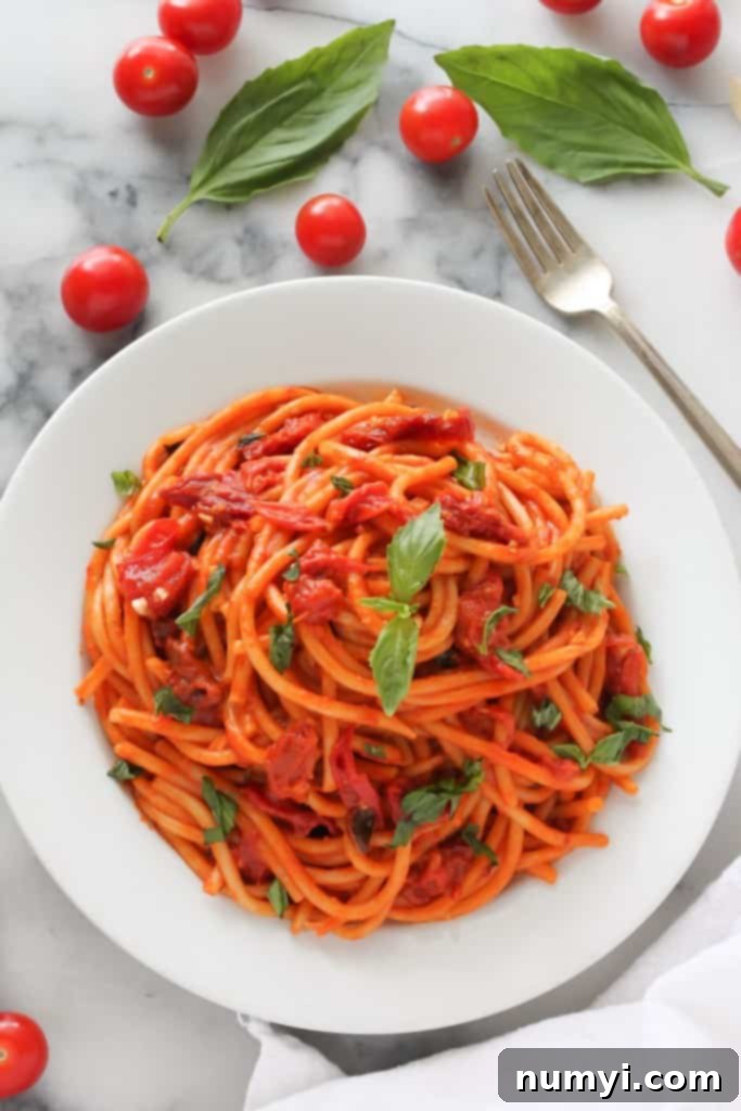 One Pan Tomato Basil Pasta: a fresh and flavorful pasta dish highlighting ripe tomatoes and aromatic basil, cooked in a single pan.