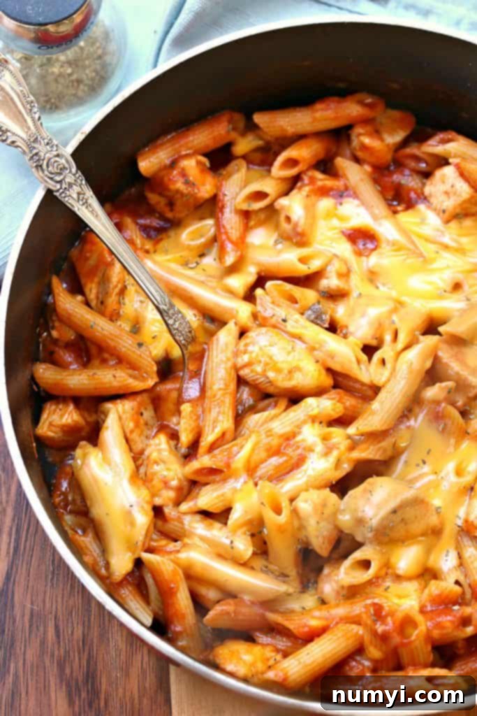 One Pot Manly Cheesy Chicken Penne: a hearty and robust pasta dish with chicken and plenty of cheese, cooked in one pot.