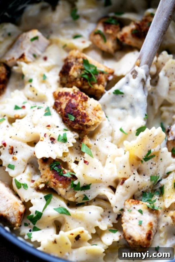 One Pot Lightened Up Chicken Parmesan Alfredo: a healthier, easier version of the classic dish, combining chicken parmesan and alfredo in one pot.