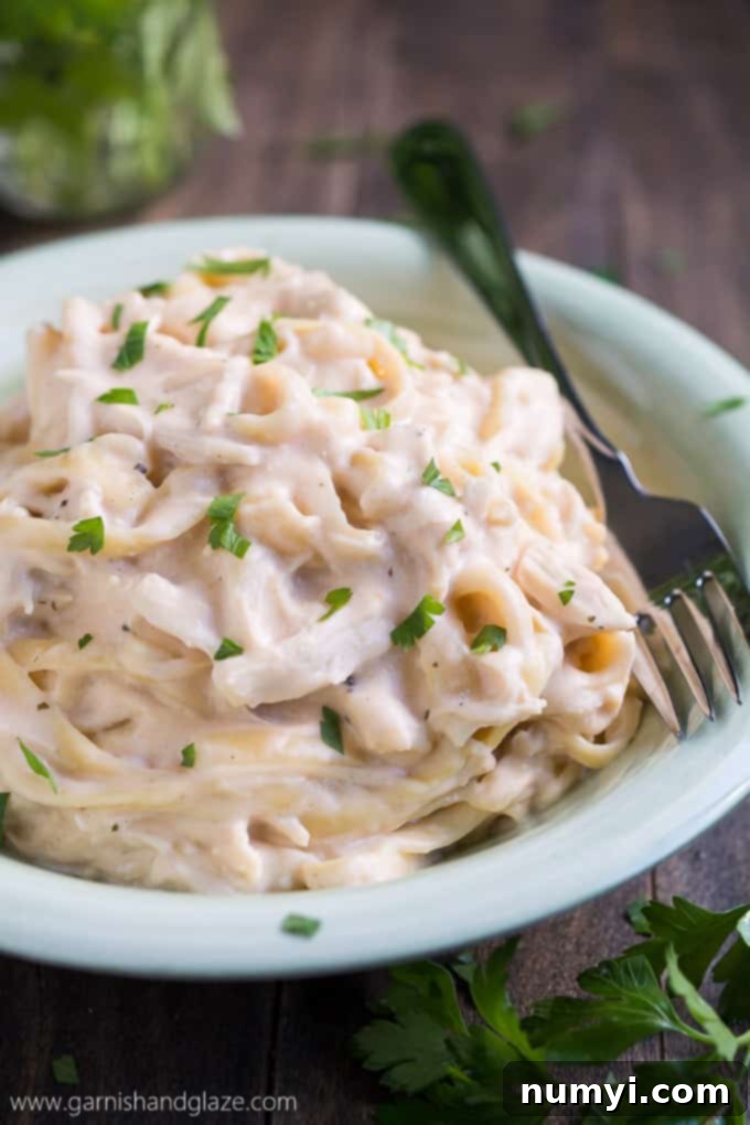 Slow Cooker Cheesy Ranch Chicken Pasta: a super easy, comforting pasta dish with chicken, ranch, and cheese, cooked in a slow cooker.
