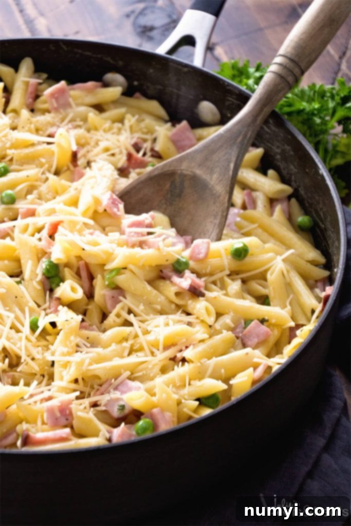 One Pot Ham and Penne Skillet: a comforting pasta dish with savory ham, all cooked in one pan for easy cleanup.