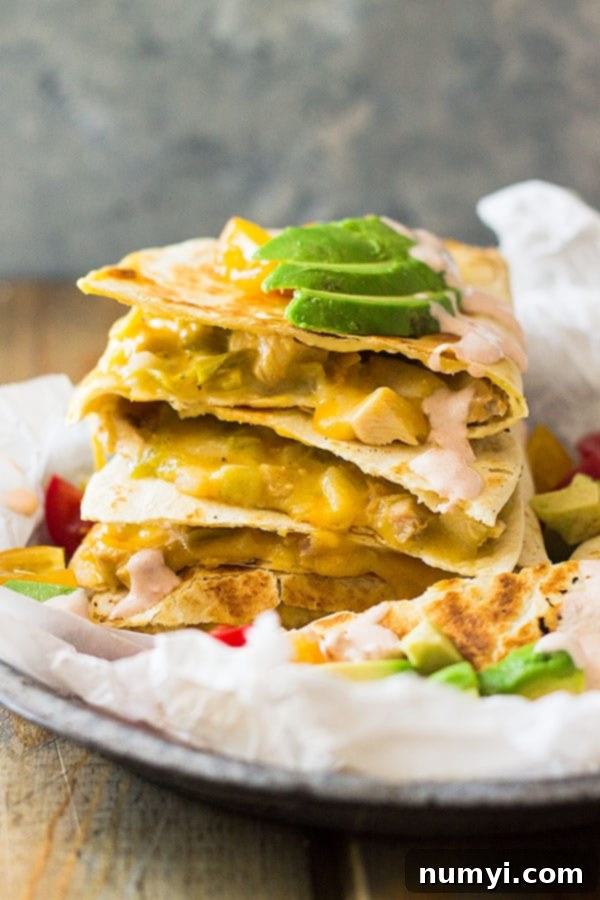 Close-up of Green Chile Turkey Quesadilla filling with shredded turkey, green chilies, and cheese