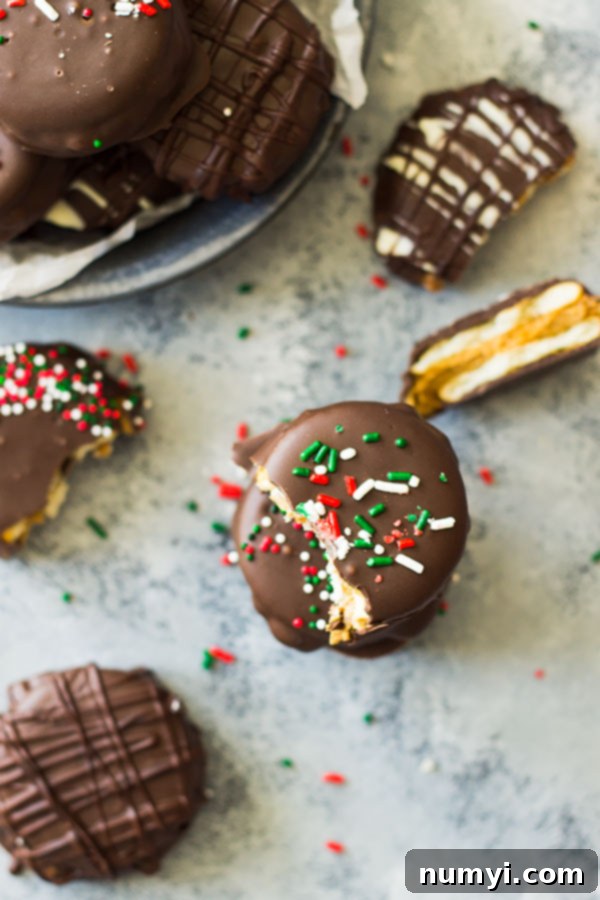 Close-up of Peanut Butter Ritz Cracker Cookies with Christmas sprinkles, showcasing the thick peanut butter layer. An easy 3-ingredient dessert.