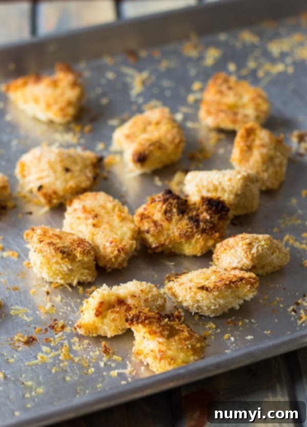 Close-up of crispy Baked Homemade Chicken Nuggets, highlighting their golden crust and perfect texture.
