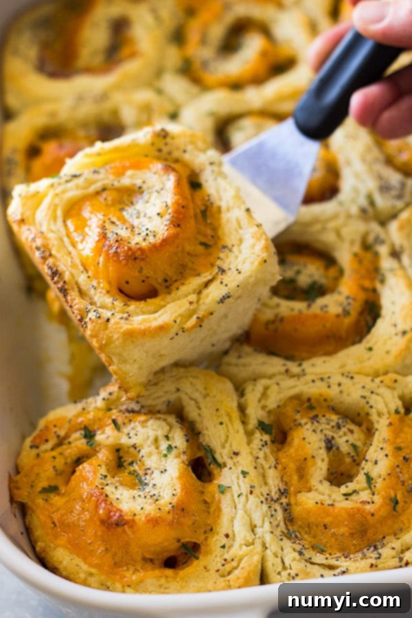Close-up of golden-baked Ham and Cheddar Biscuit Rolls, ready to be served. Ideal for a family breakfast or gathering.