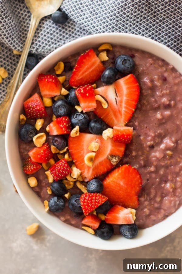 Slow Cooker Berry Oatmeal with steel cut oats and mixed berries, a healthy crockpot breakfast for busy mornings.