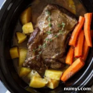 Melt-in-Your-Mouth Pot Roast 7 pot roast in slow cooker with carrots and potatoes.
