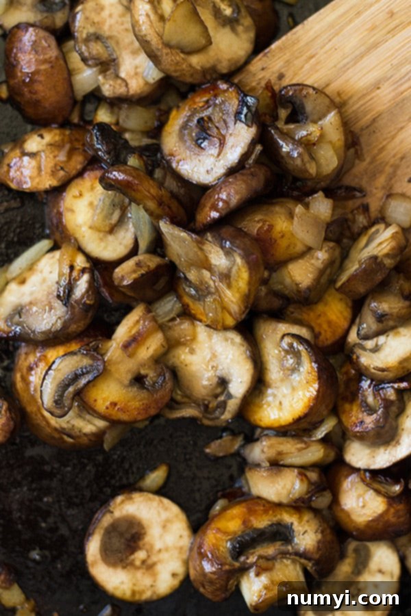 cooked sliced mushrooms in a pan