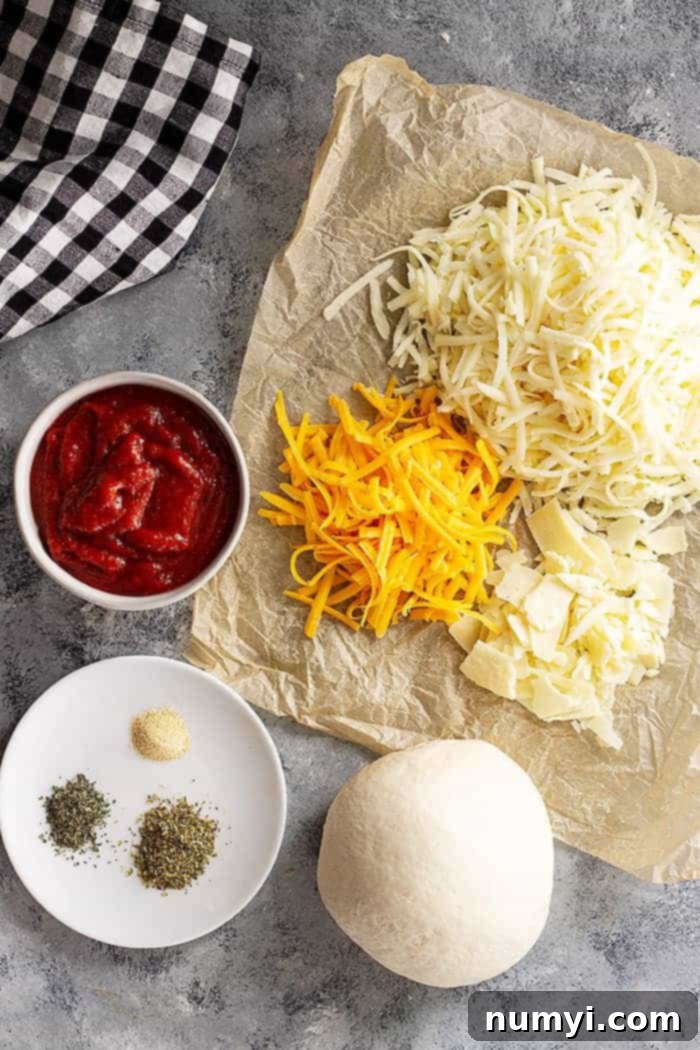 Perfectly Homemade Cheese Pizza 3 overhead: ingredients needed for cheesy pizza