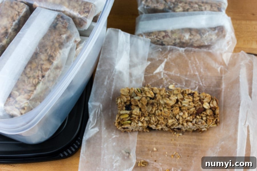 Sliced granola bars wrapped individually in wax paper.