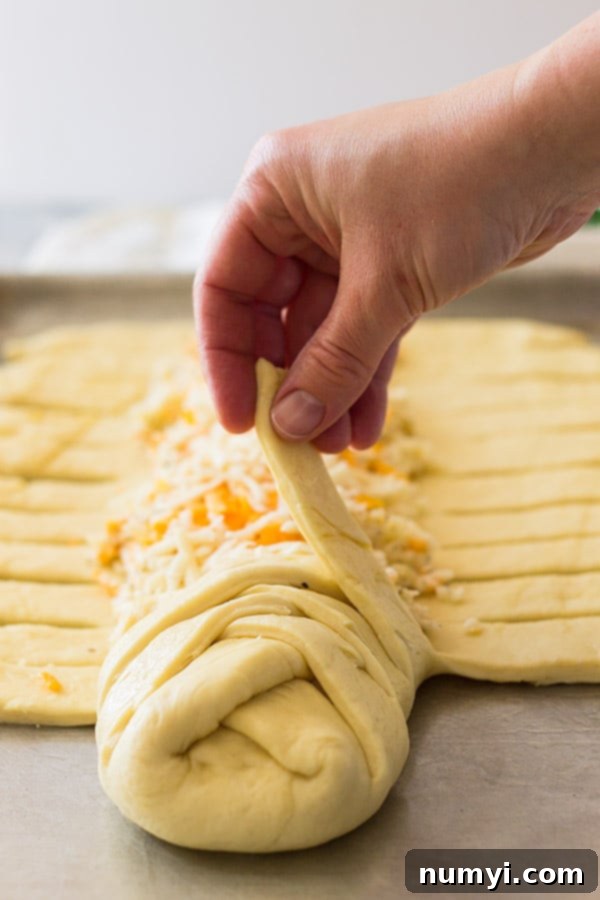 Three cheese braid showing how to braid the dough. 