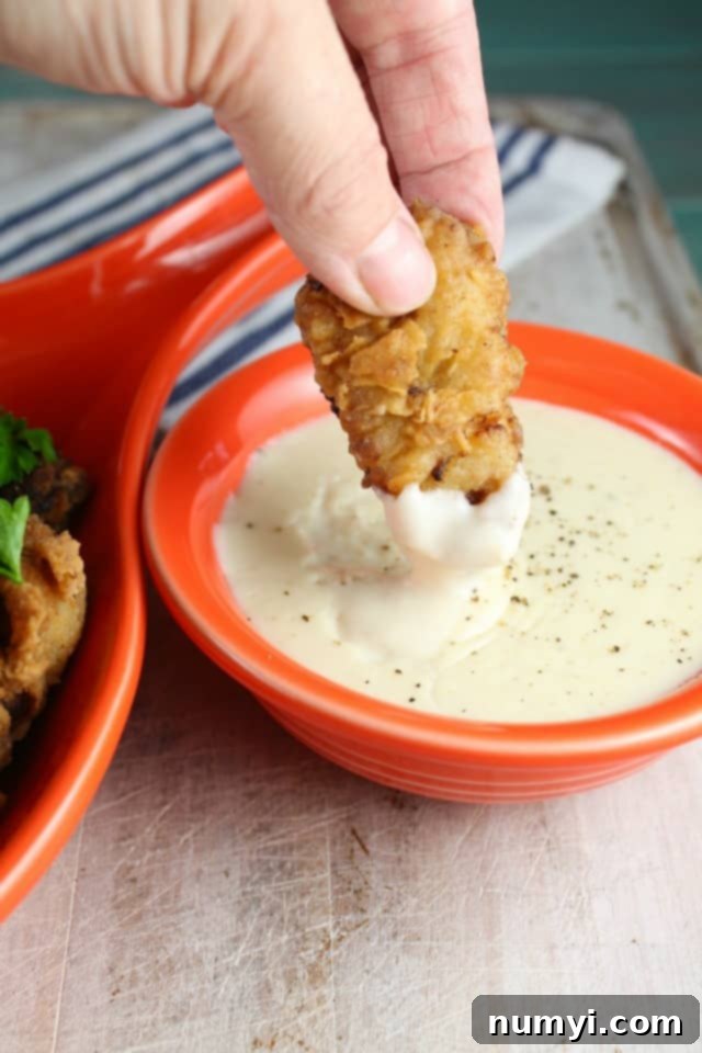 Golden Chicken Fried Steak Bites served with creamy country gravy