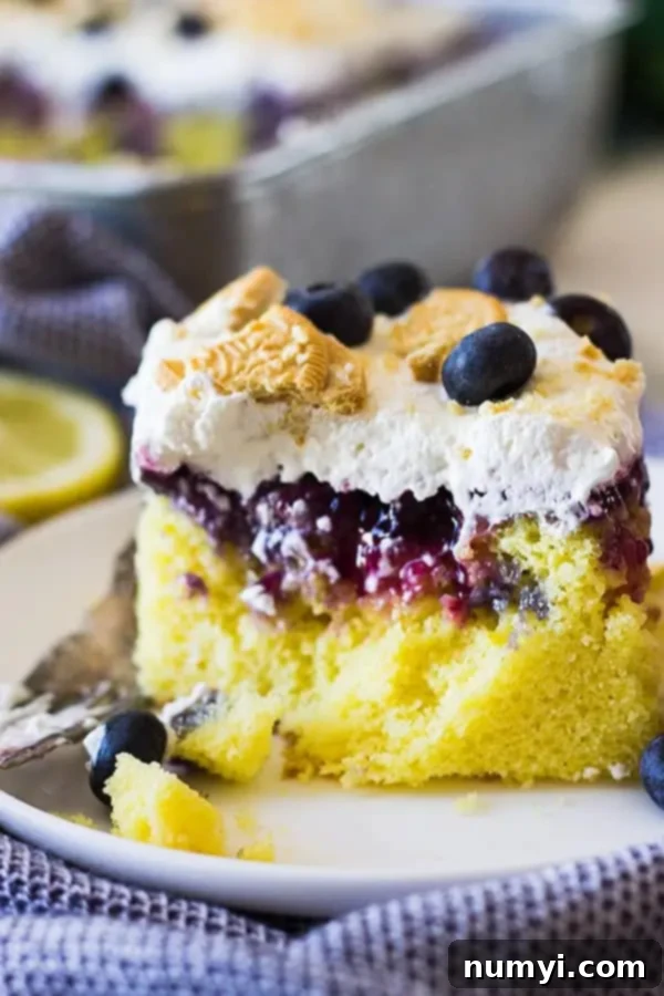 closeup: lemon poke cake with a forkful taken out so the layers are visible