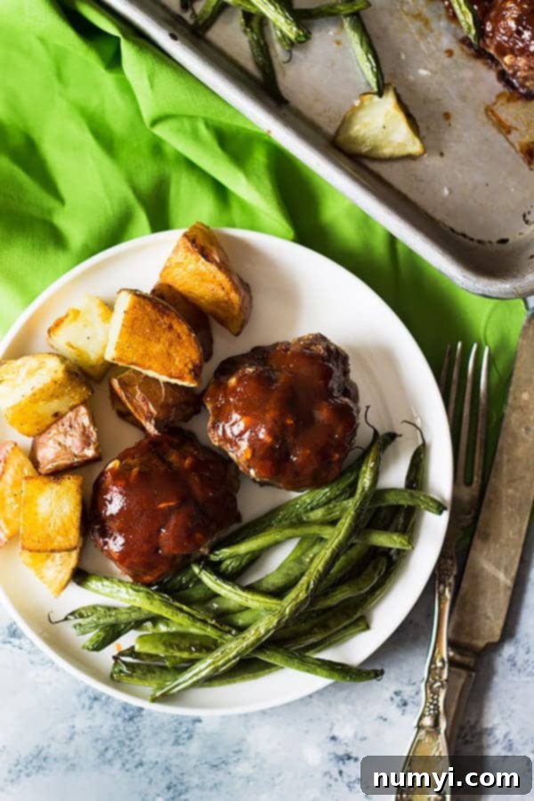 This Sheet Pan BBQ Meatballs Green Beans and Potatoes dinner is super easy, hearty and comforting! | www.countrysidecravings.com
