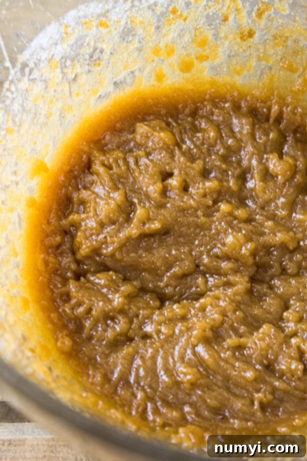 Creamed butter and sugar in glass bowl