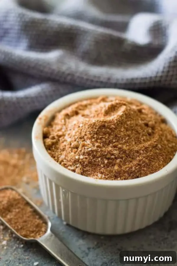 closeup: pork spice rub in white ramekin with spoon