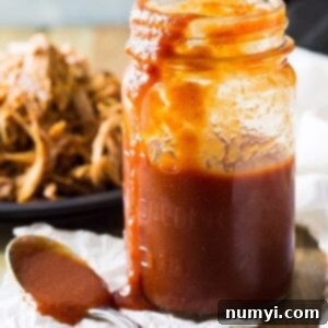 Texas style BBQ sauce in jar with spoon
