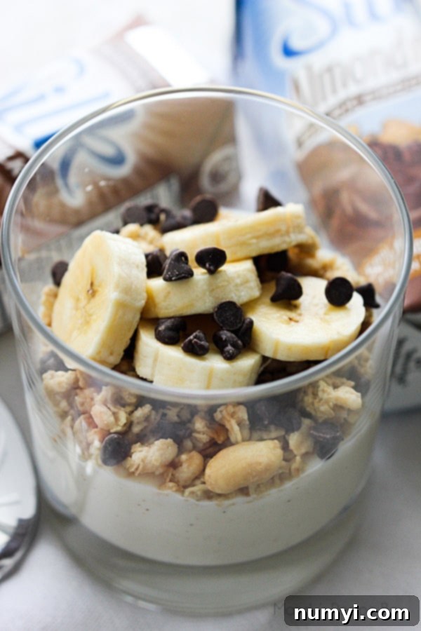 Refreshing Breakfast Parfait with layers of yogurt, granola, and fresh berries in a glass.
