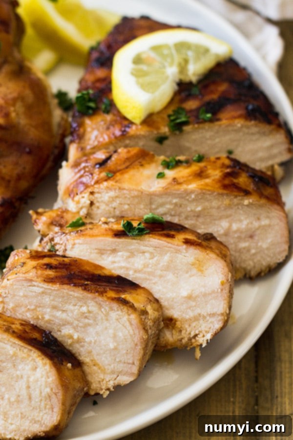 Slices of chicken on white plate