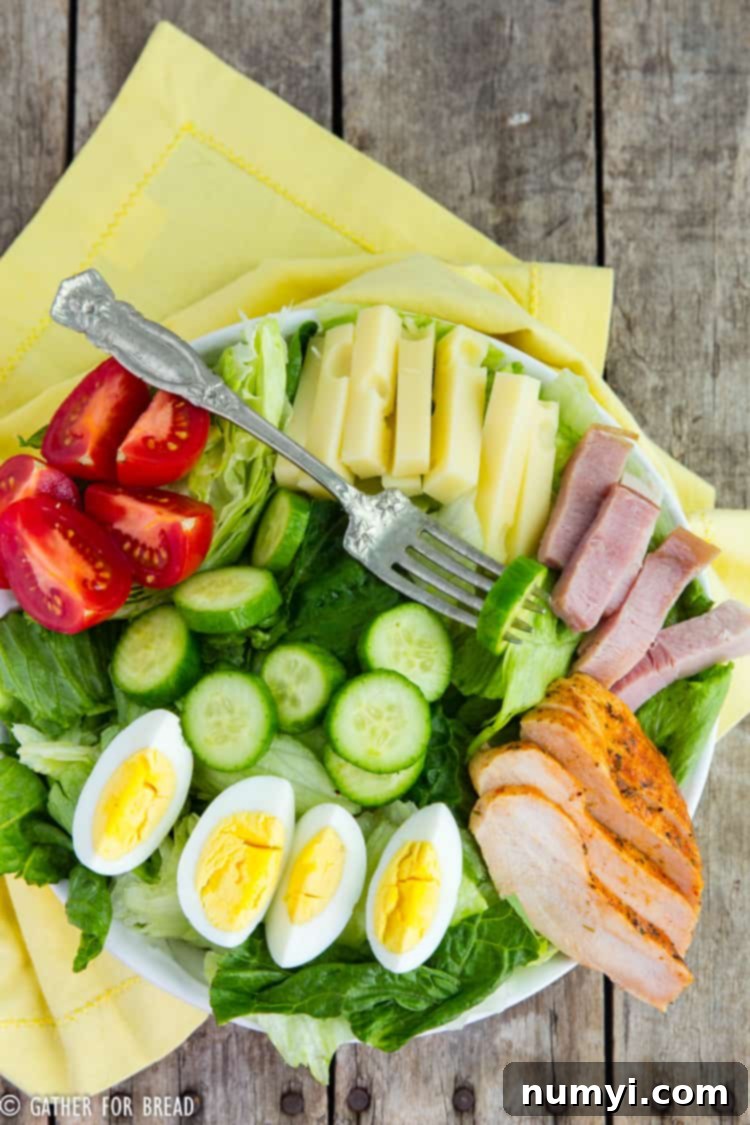 A vibrant Chef's Salad loaded with fresh greens, various vegetables, cheese, and protein, perfect for a healthy and satisfying meal.