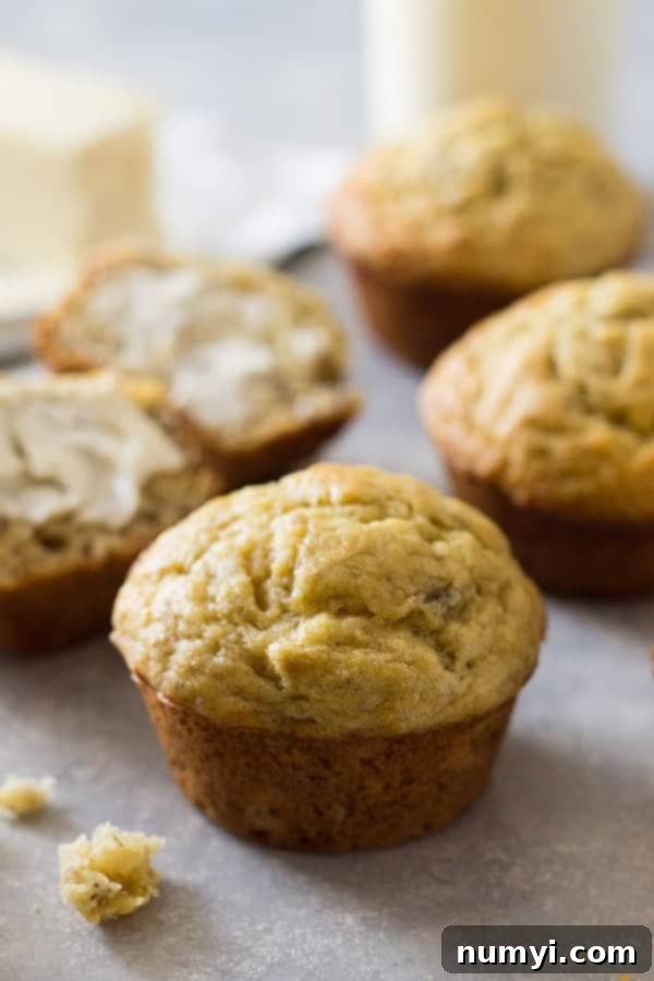 Deliciously moist banana muffins arranged on a wire rack, ready to be enjoyed.