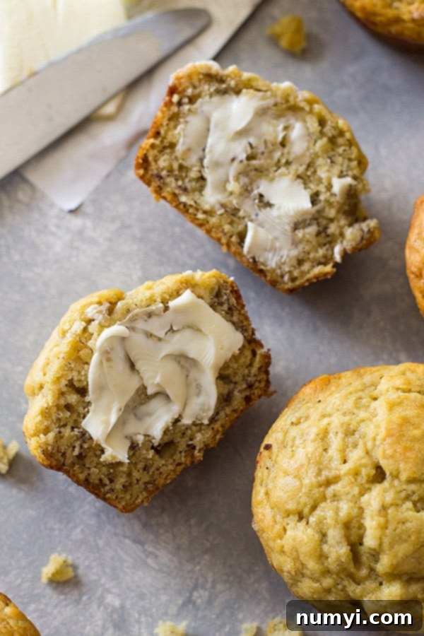 A bowl of perfectly mashed ripe bananas, ready to be mixed into muffin batter.