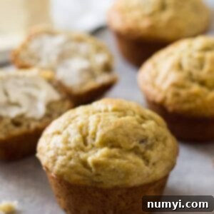 Freshly baked easy banana muffins cooling on a wire rack.